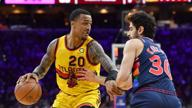 Atlanta Hawks forward John Collins (20) moves to the basket against Philadelphia 76ers guard Furkan Korkmaz (30) during the second quarter at Wells Fargo Center.